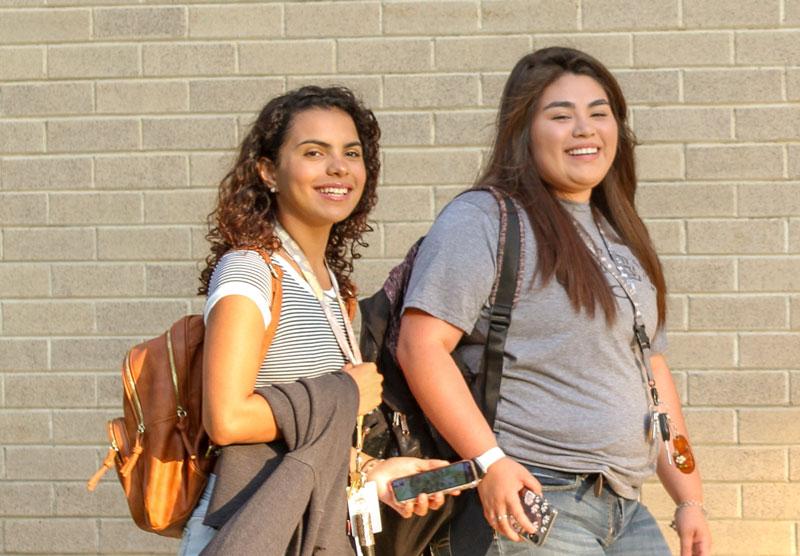 two female students walking on campus